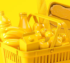 madvarer, der er lavet af gul plastik, i indkøbskurv. 